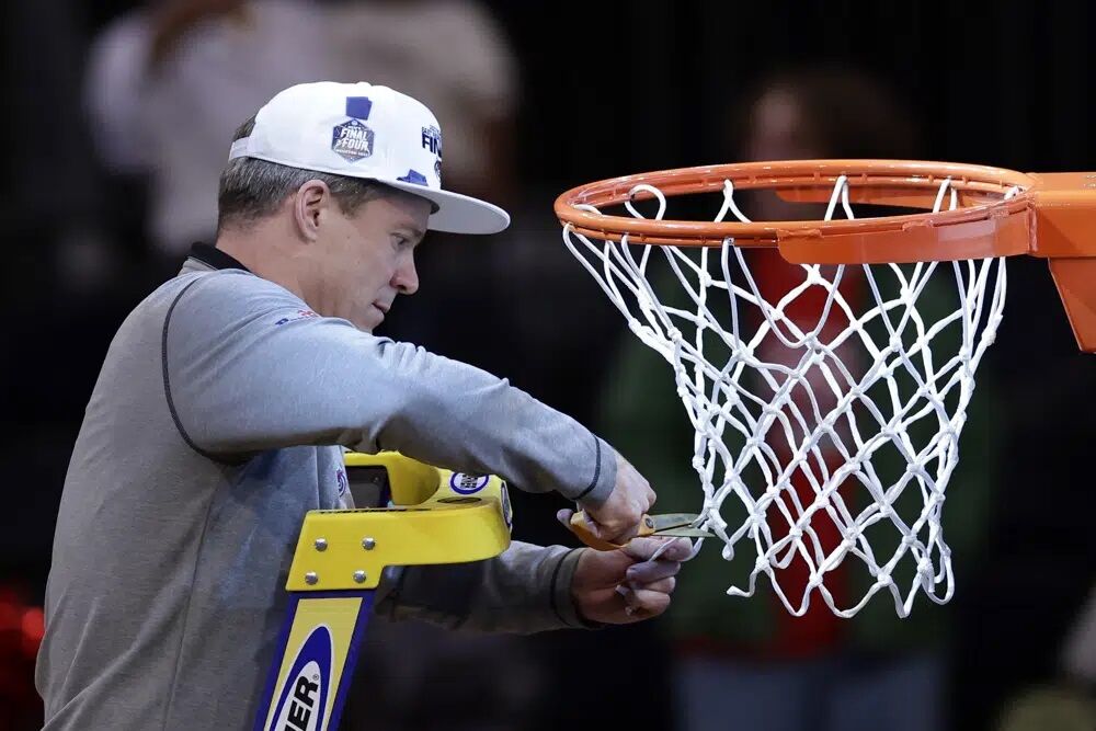 Dusty May cuts down nets